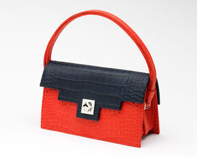 Quoin Medium Handbag in red with navy flap
