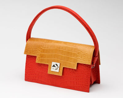 Quoin Medium Handbag in red with tan flap